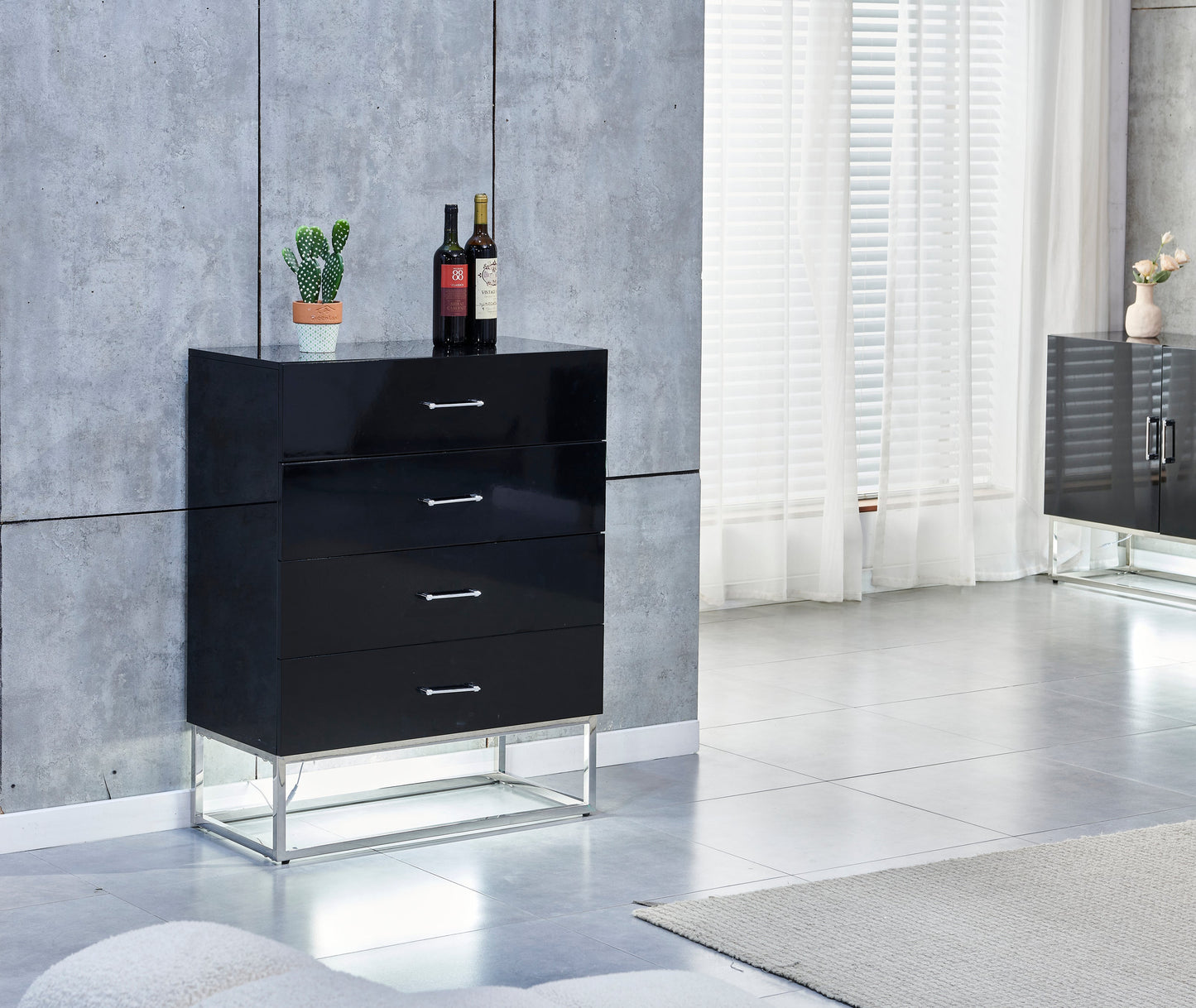 Commode Alya en bois laqué noir et pieds en acier inoxydable argenté