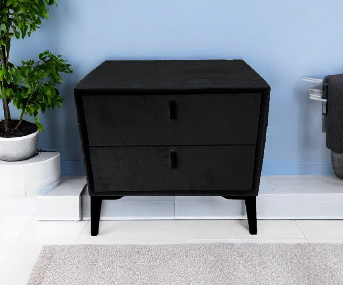 Black velvet bedside table with silver legs