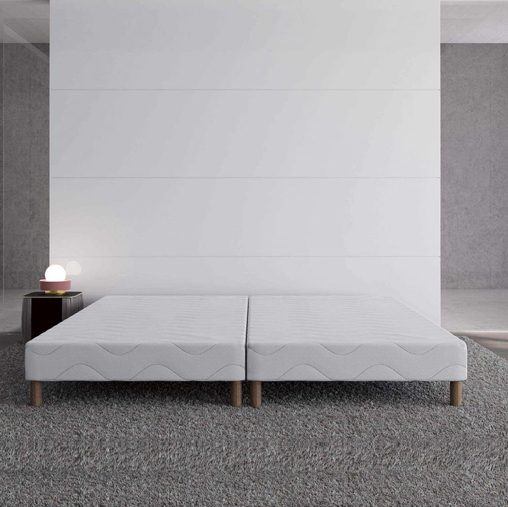 White upholstered box spring with wooden legs 90x190